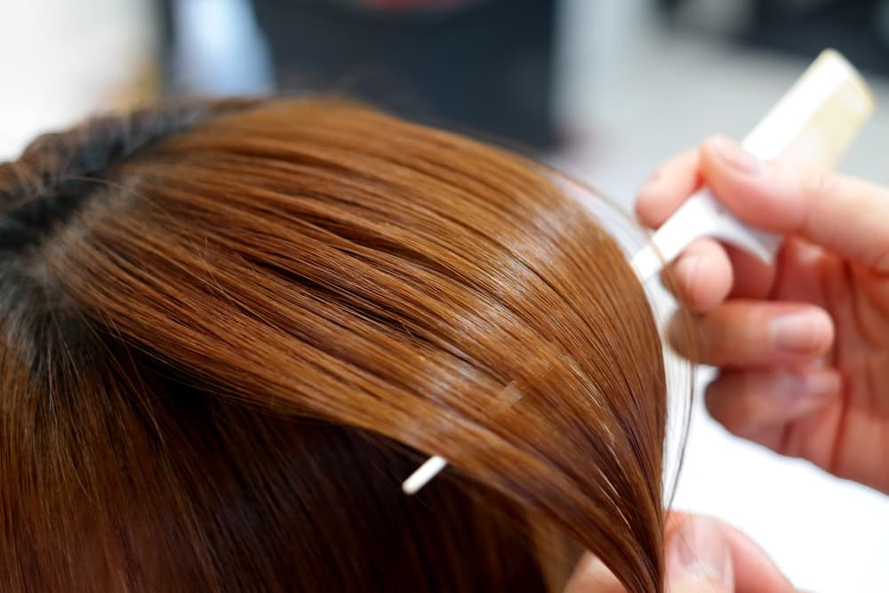 comb in womans hair