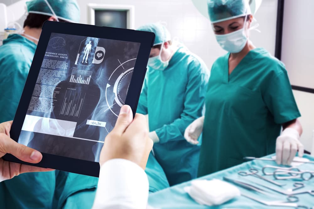 doctor looking at tablet xray of stomach before surgery