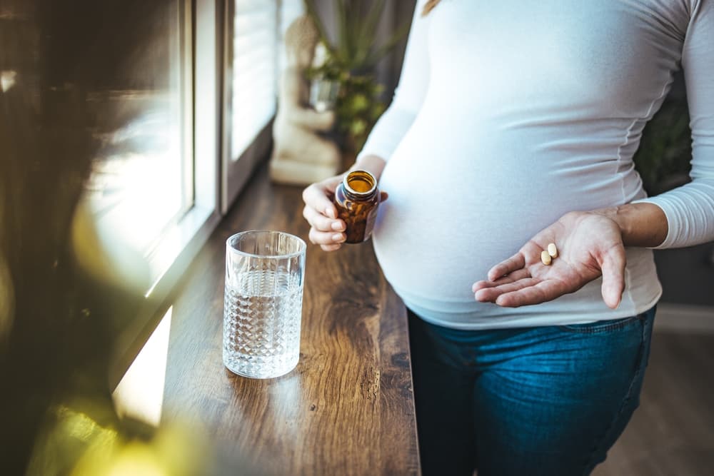 pregnant woman taking pills