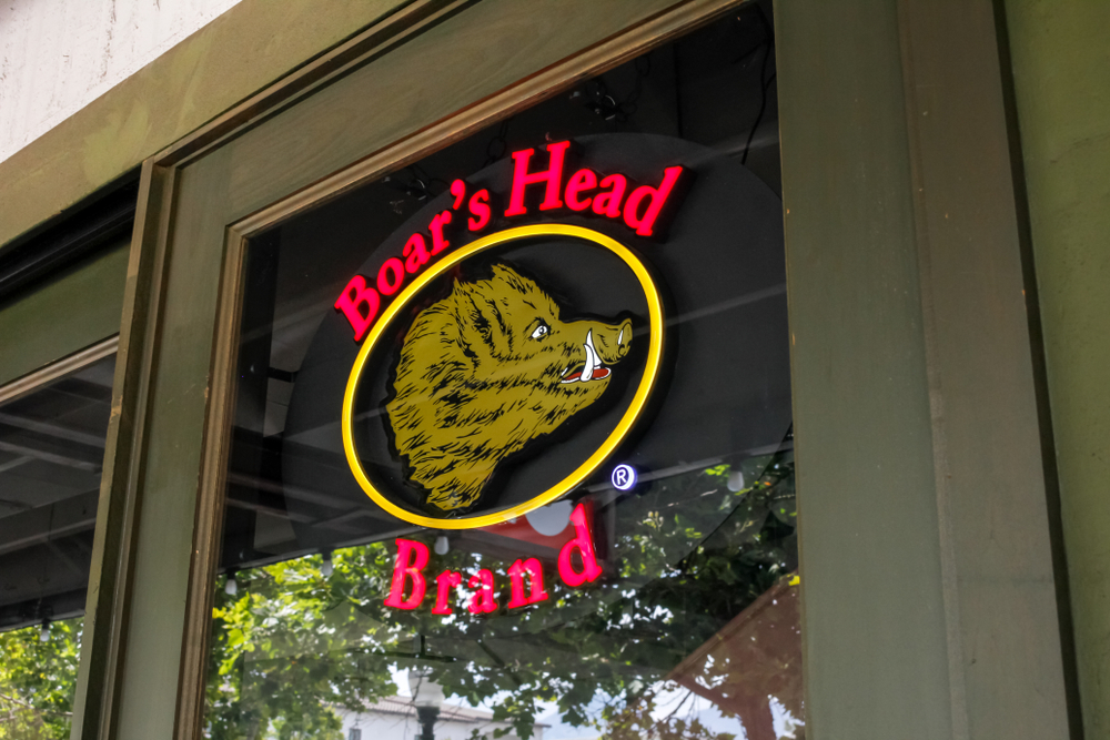 A view of a window sign advertising the availability of Boar's Head deli meat at a restaurant - LLN