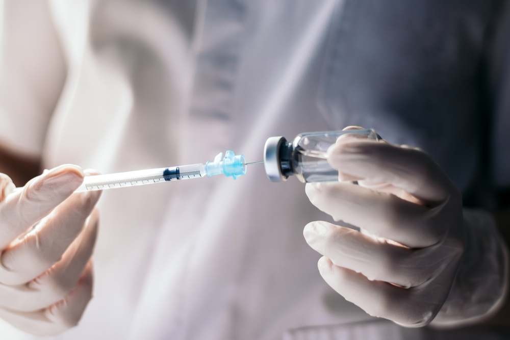 doctor filling syringe at numale medical center - numale medical malpractice and fraud lawsuits